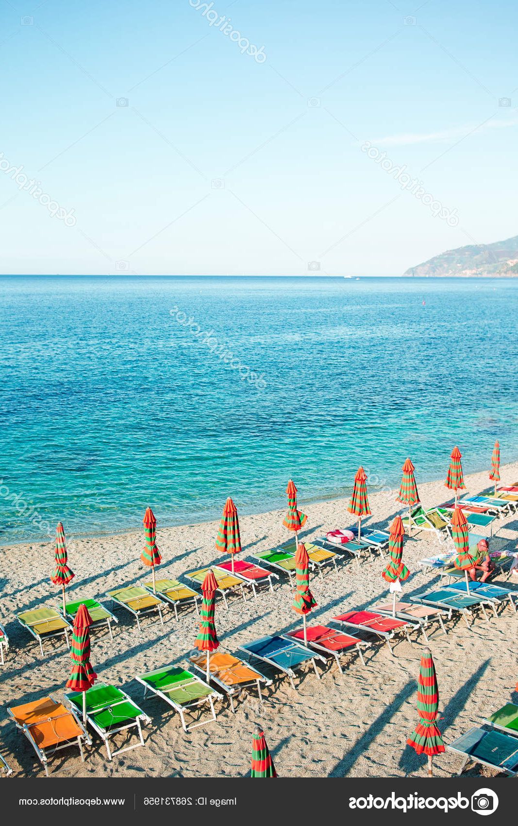 Empty Beach With Closed Umbrellas On Italian Coast — Stock Photo © D Throughout Favorite Italian Beach Umbrellas (View 17 of 20)