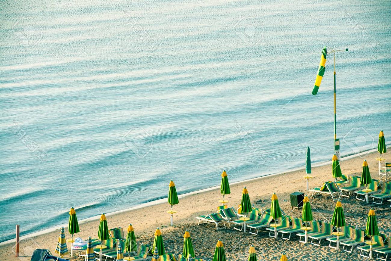 Famous Italian Beach Umbrellas Throughout Empty Italian Beach With Umbrellas In Early Morning (View 12 of 20)