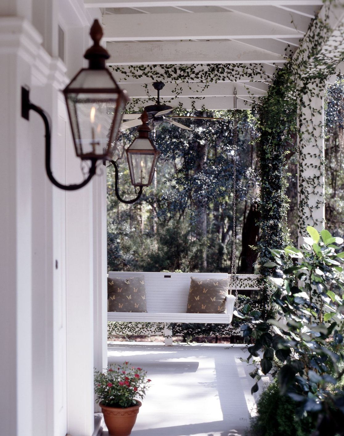 A Traditional Front Porch With Antique Gas Light And Porch With Regard To Best And Newest Lamp Outdoor Porch Swings (View 4 of 25)