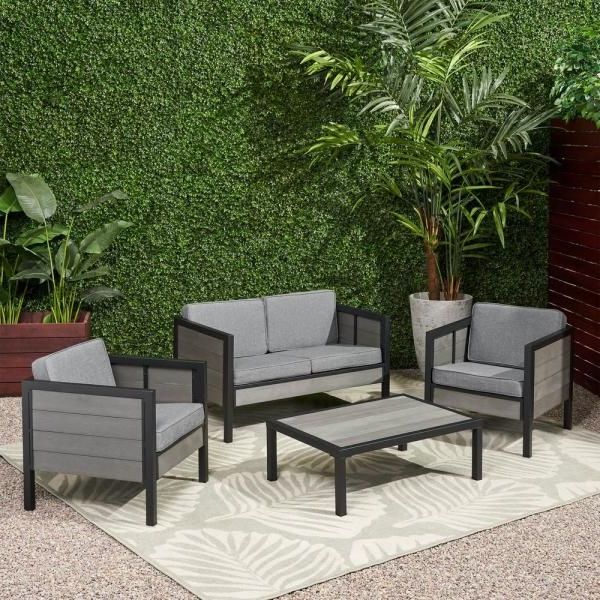 Gray Wood Outdoor Conversation Sets With Regard To Best And Newest Noble House Jax Black 4 Piece Faux Wood Patio Conversation Seating Set (View 10 of 15)