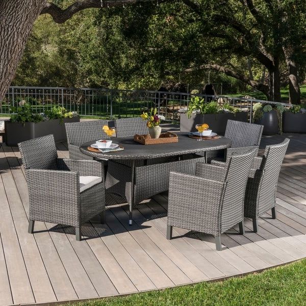 Newest Cypress Outdoor 7 Piece Oval Wicker Dining Set With Cushions With 7 Piece Outdoor Oval Dining Sets (View 10 of 15)