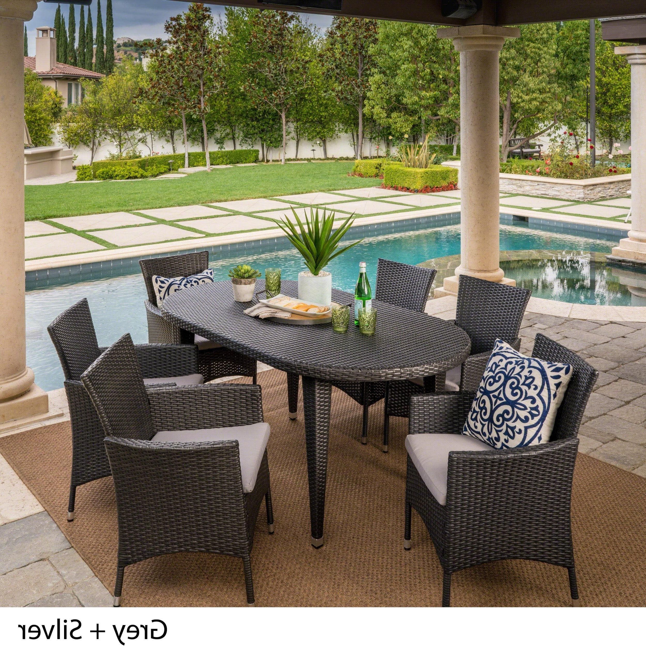 Vincent Outdoor 7 Piece Oval Wicker Dining Set With Cushions With Regard To Famous 7 Piece Large Patio Dining Sets (View 2 of 15)