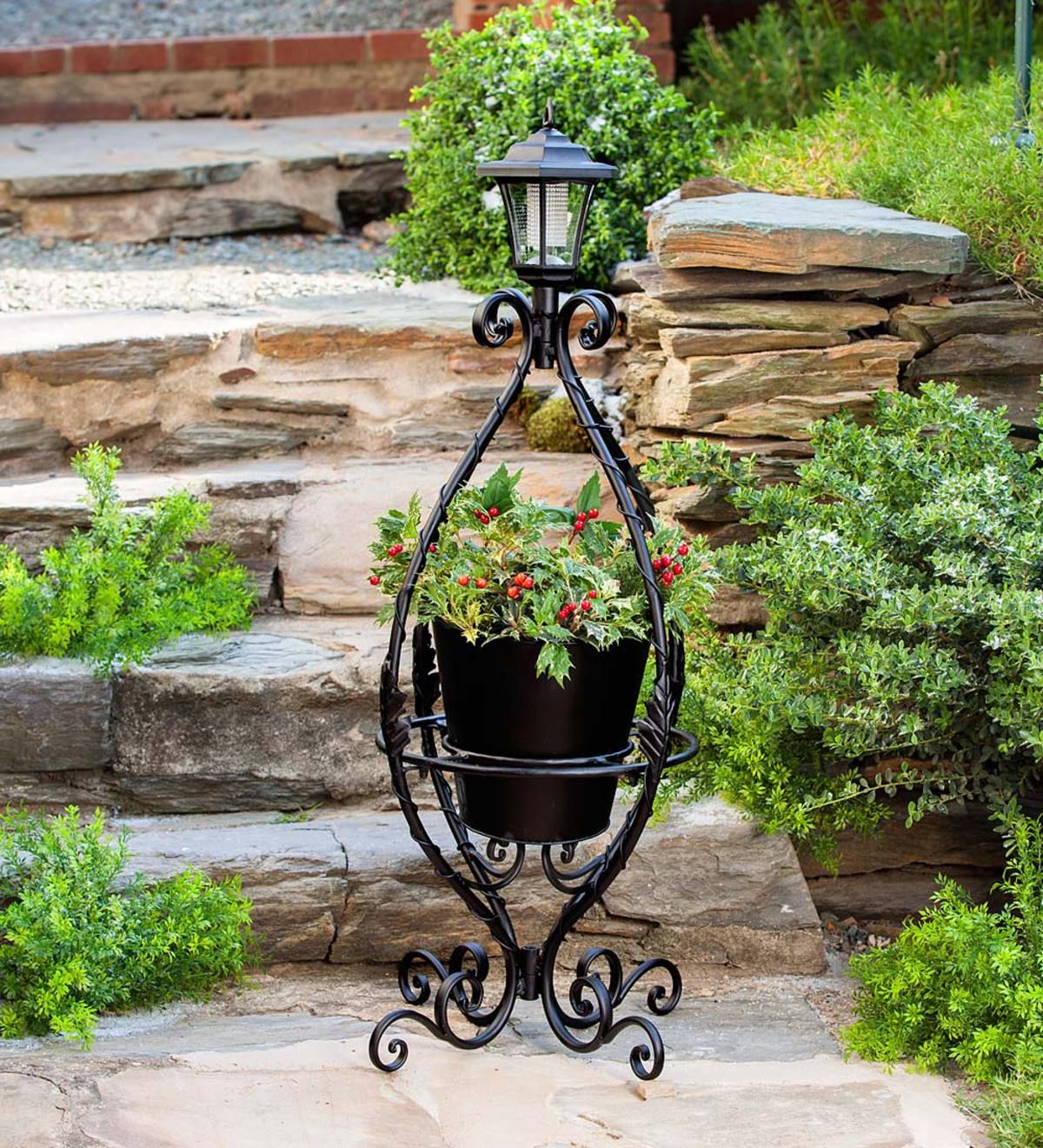 Best And Newest Black Wrought Iron Plant Stand With Solar Light (View 3 of 15)